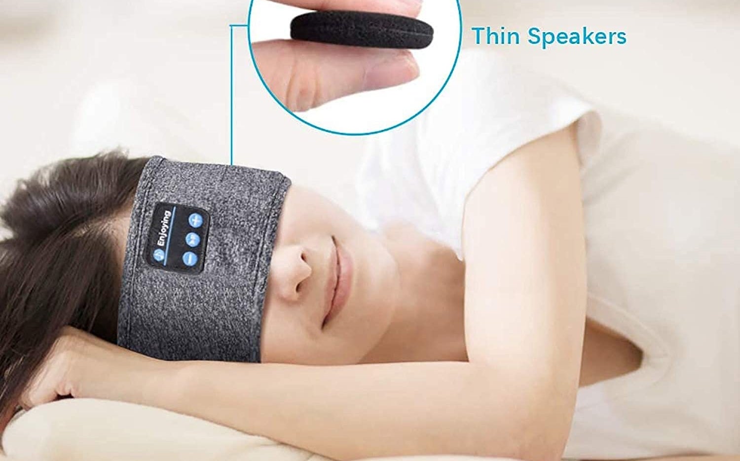 A person sleeping contently while wearing a bluetooth headband