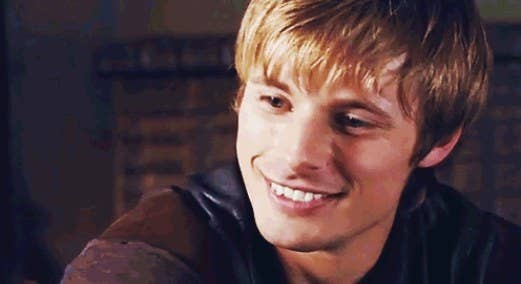 arthur with shaggy hair smiles