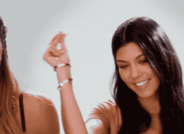 A GIF of Kourtney Kardashian snapping her fingers and the text Add To Cart appearing on the screen