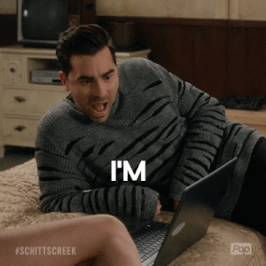 A GIF of a man looking at a laptop and saying &quot;I&#x27;m obsessed with this&quot;