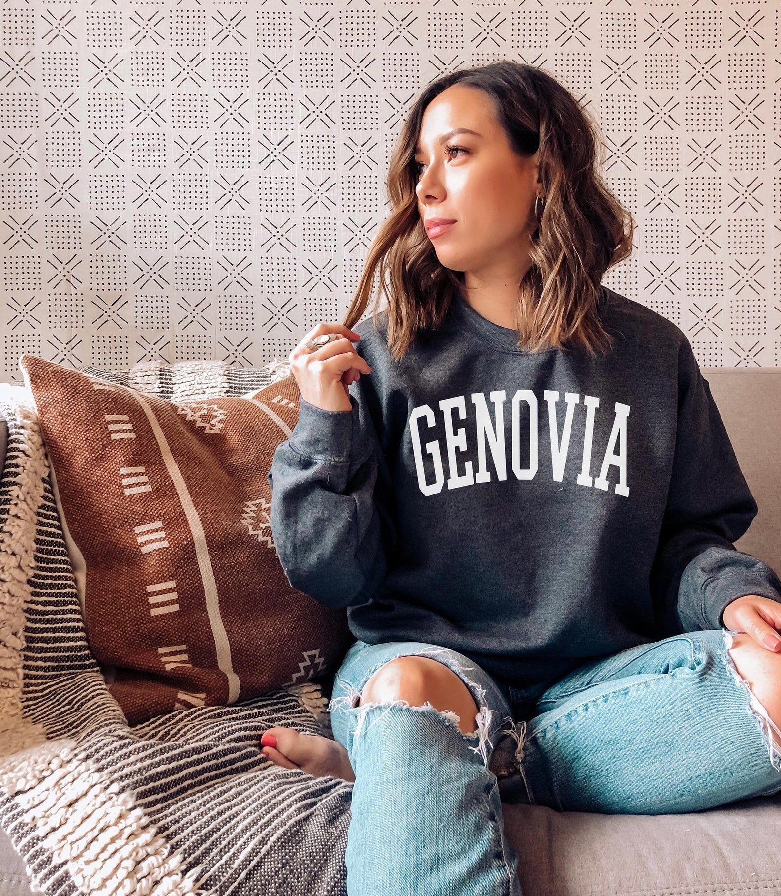 model wearing a genovia sweatshirt in dark gray