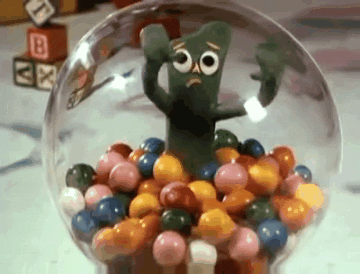 Gumby trying to get out of a gumball machine