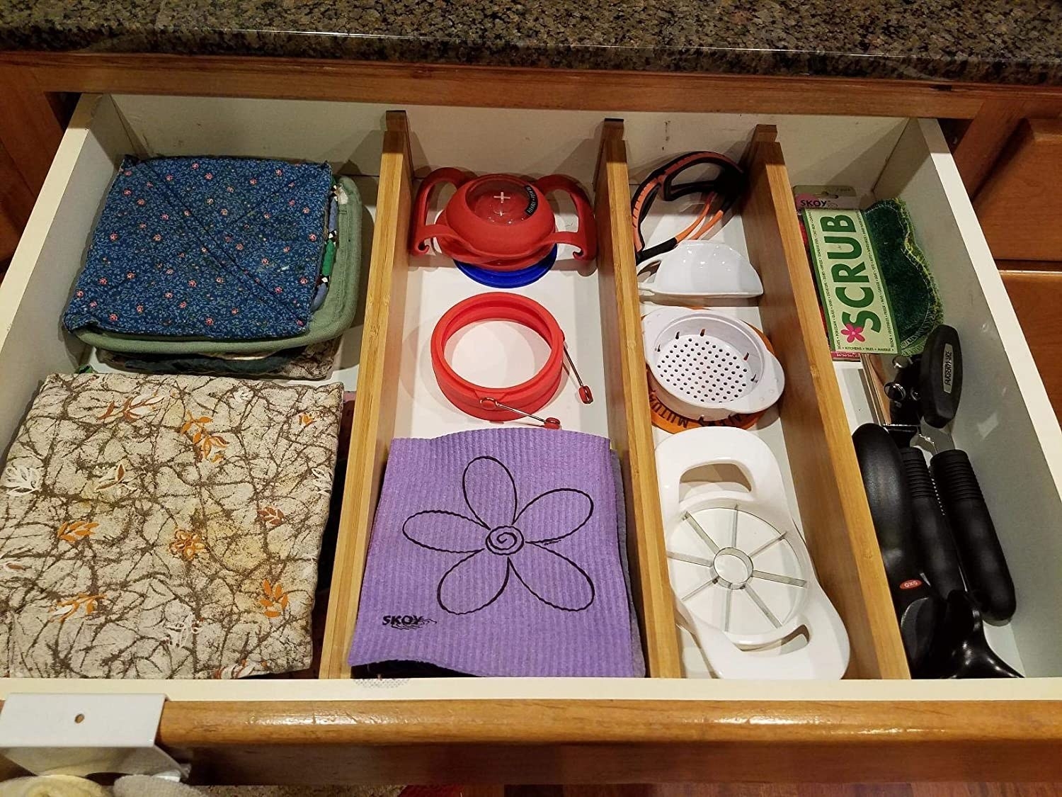 three expanding dividers organizing a drawer