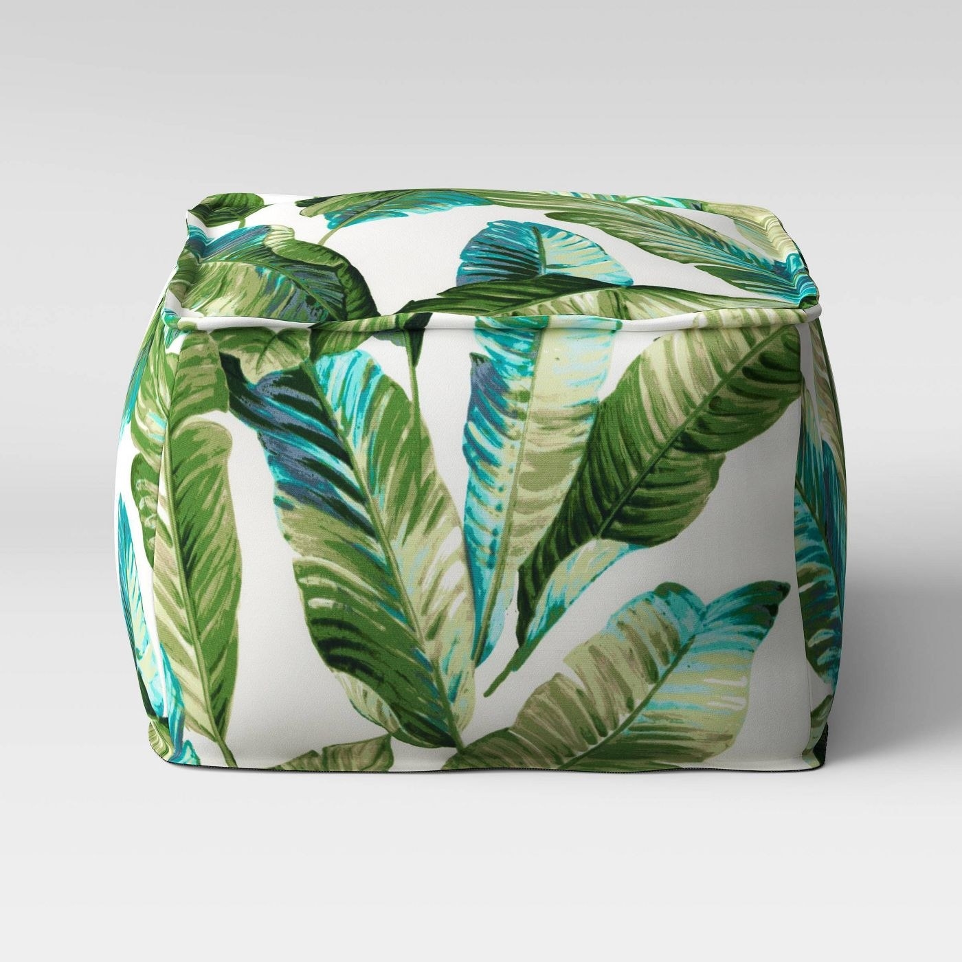 tropical green and white leaf print pouf
