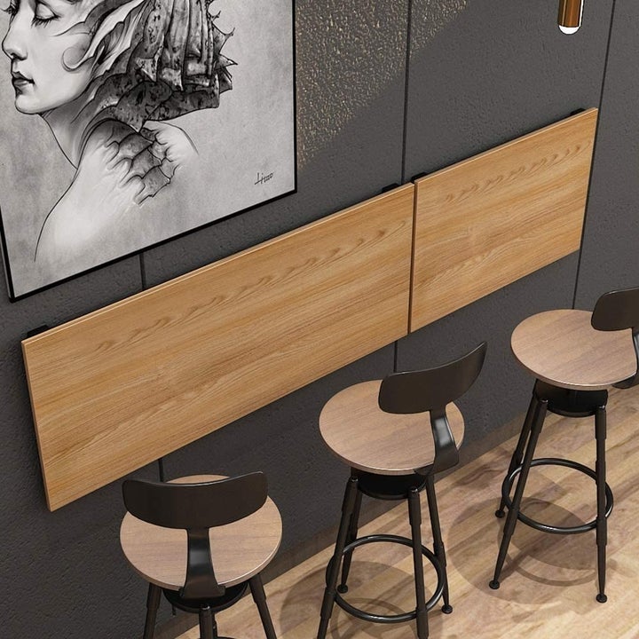 the folded desk on a wall