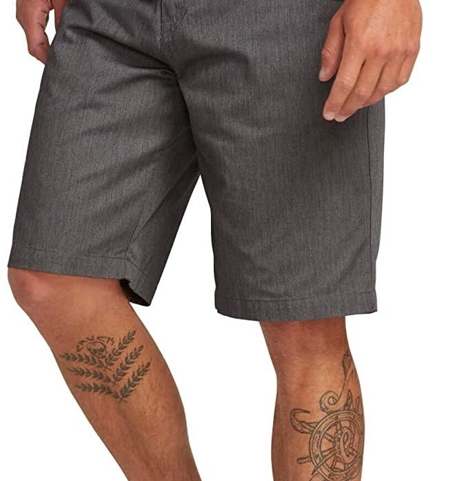 A model wears the shorts in charcoal gray