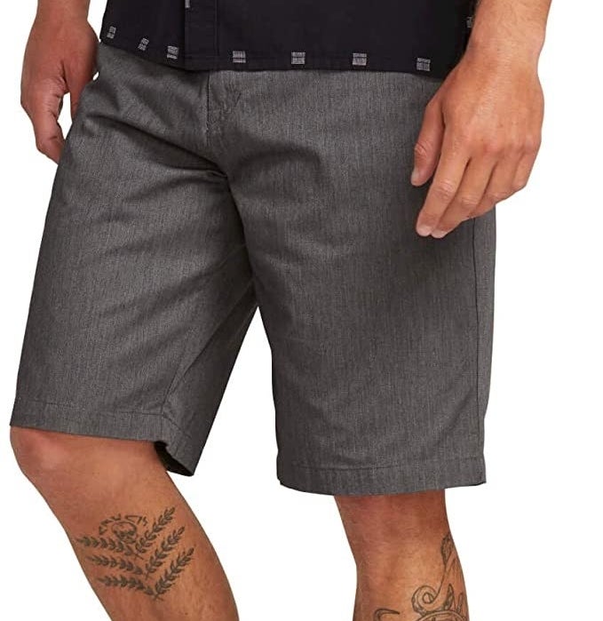 A model wears the shorts in charcoal gray