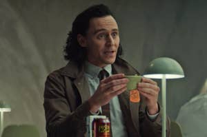 Loki holding up Mobius's ruined salad
