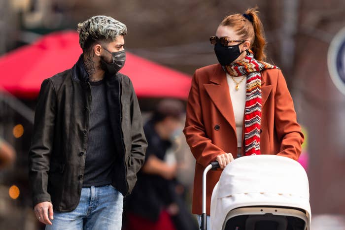 Zayn Malik and Gigi Hadid are pictured pushing a stroller in New York City