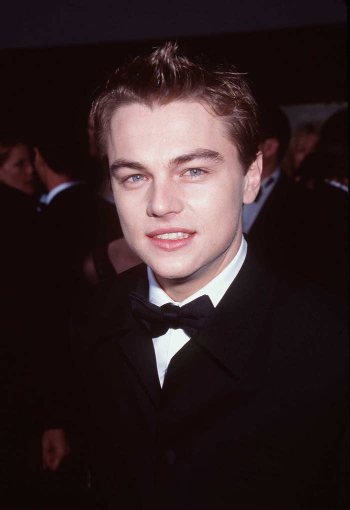 Leonardo DiCaprio smiles while wearing a tuxedo
