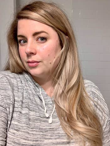 Reviewer showing blown out hair after using product