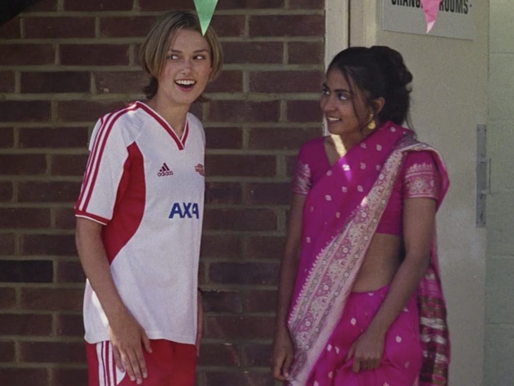 Jess and Jules standing outside of their locker room