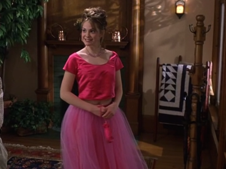 Bianca standing in her foyer before heading off to prom