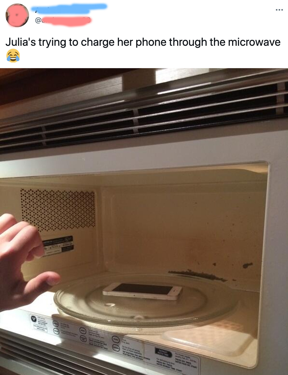 phone sitting inside a microwave