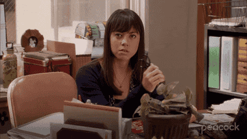 Angry April Ludgate holding scissors