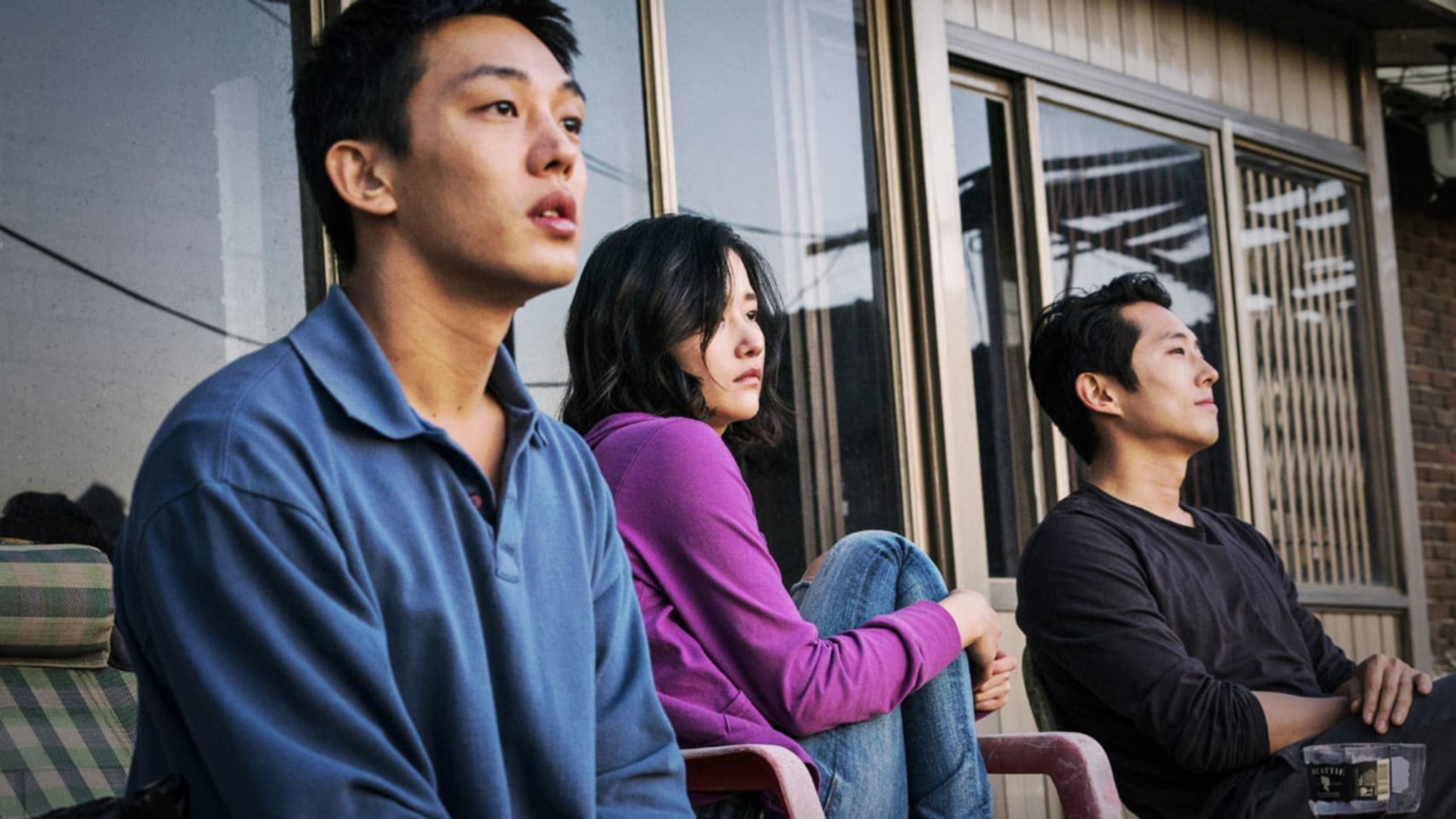 Yoo Ah-In, Jeon Jong-seo, and Steven Yeun watch a sunset from a back porch