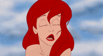 annoyed ariel blowing hair from her face