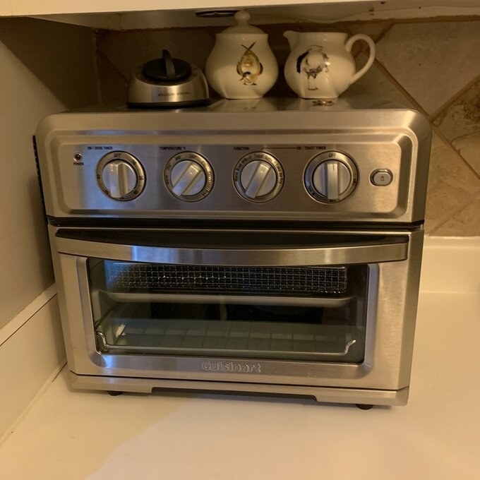 a silver combination toaster and air fryer