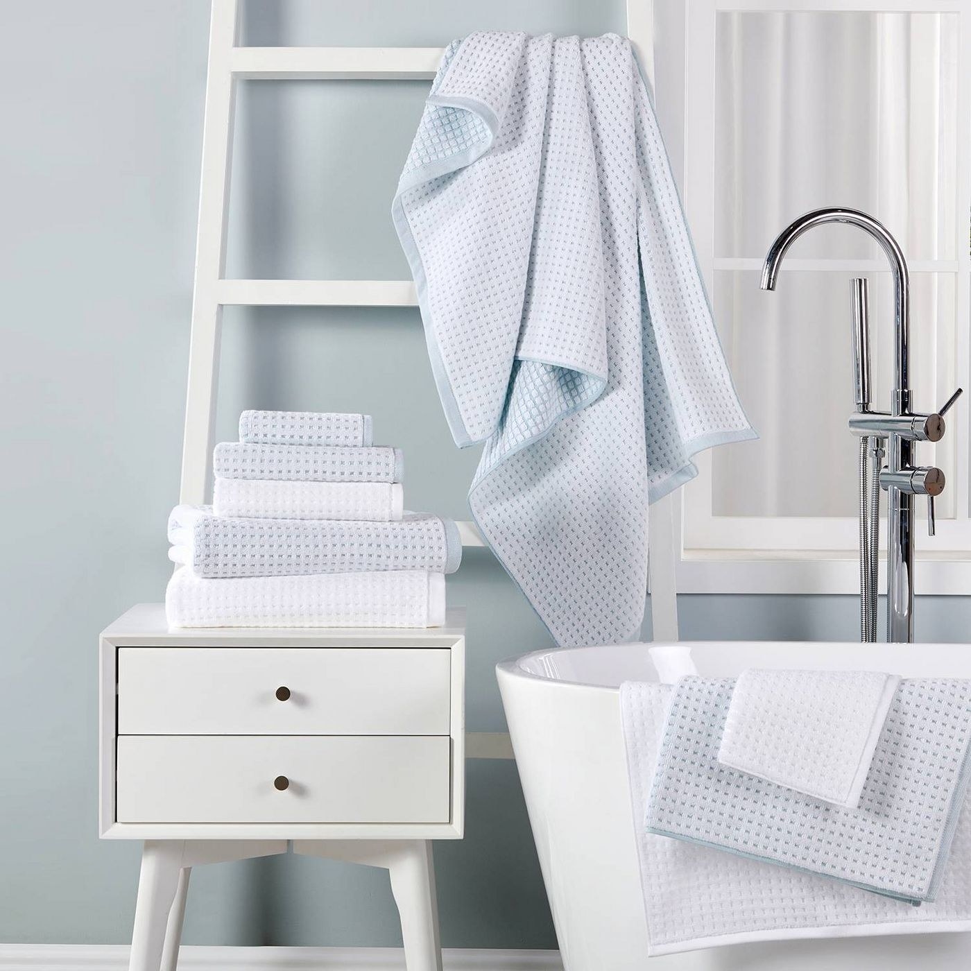 blue and white towels in a bathroom