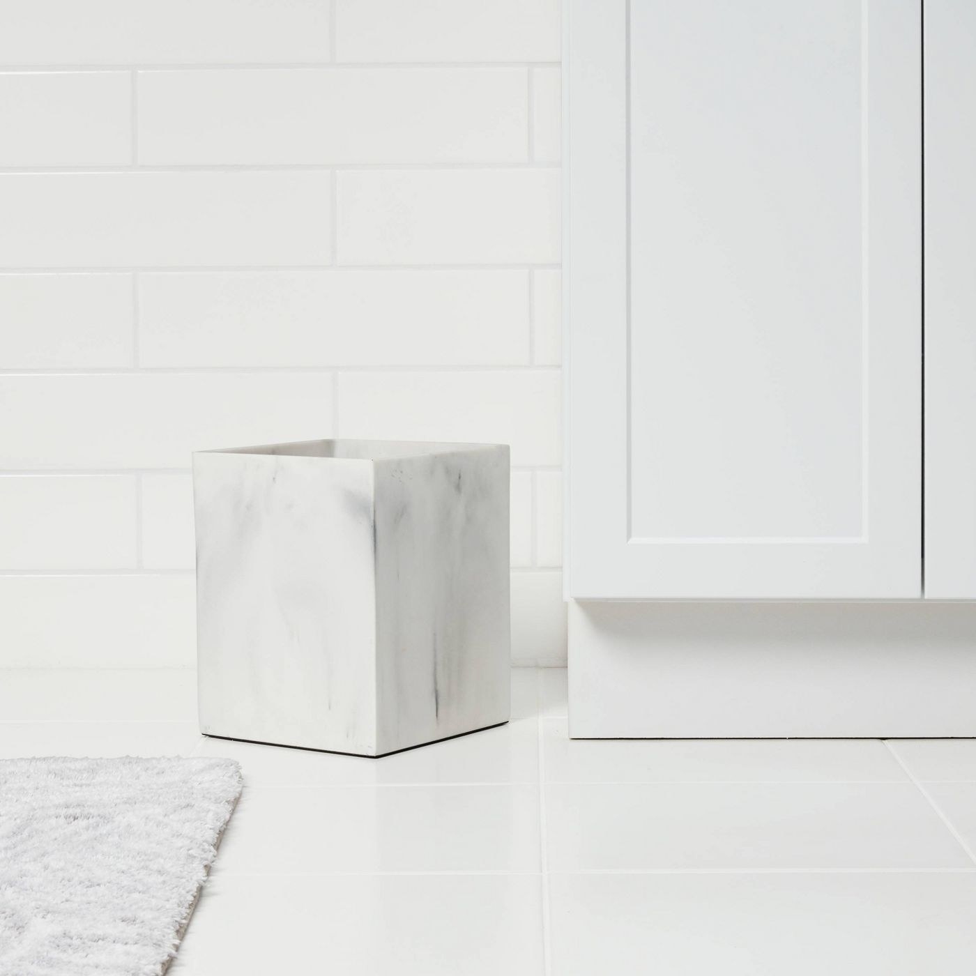 a marble-printed square trash can