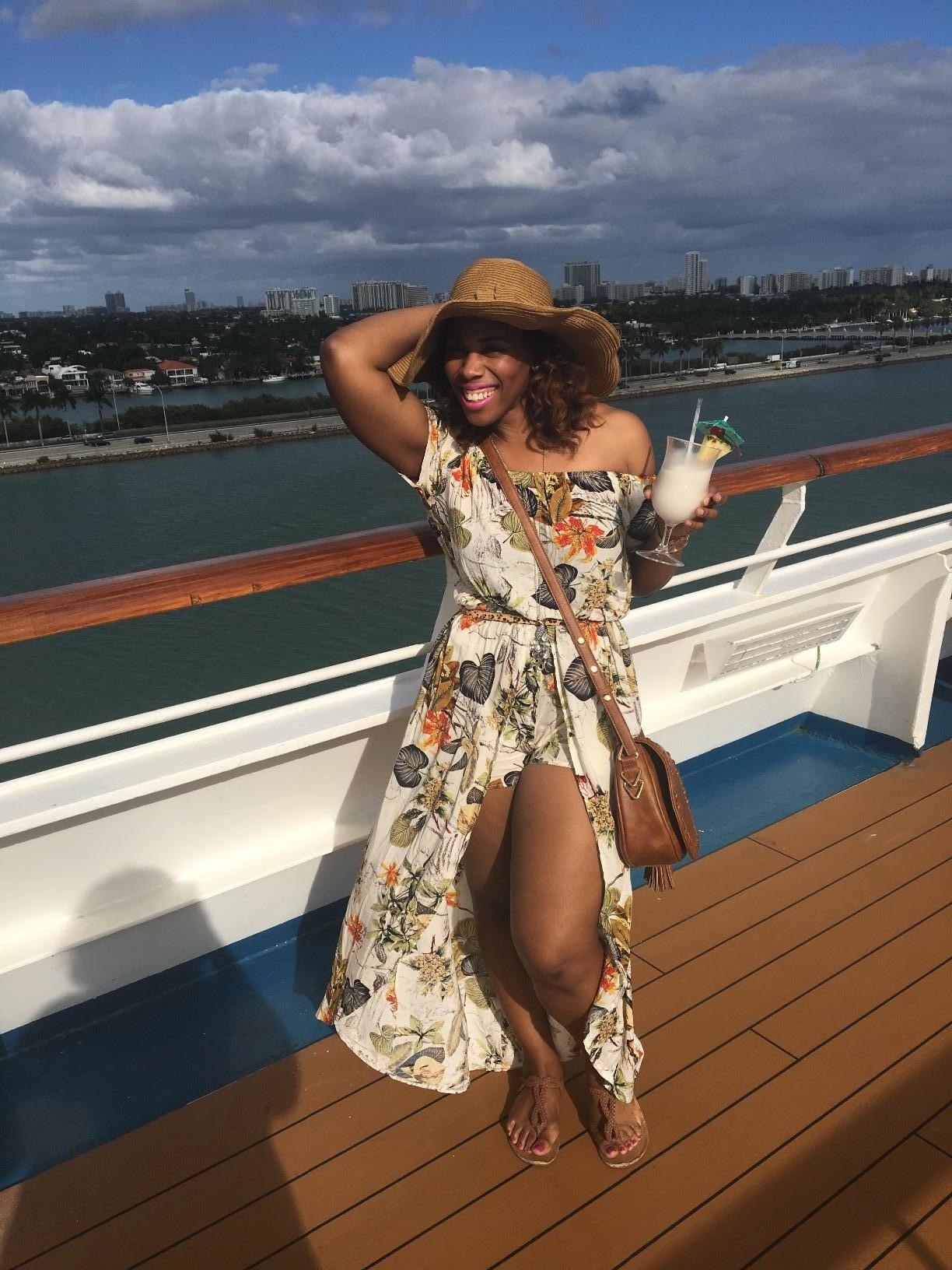 image of reviewer wearing the floral party split maxi romper on a boat