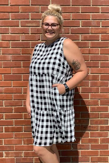 a reviewer wearing the dress in black and white 