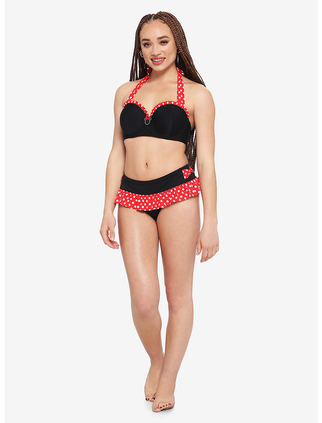 model wearing a black and red two piece with red polka-dotted trim on on the top and straps and on the ruffled skirt of the black bikini bottom. Minnie&#x27;s signature