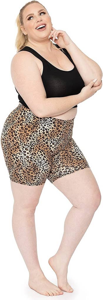 Model wearing bike shorts with cheetah print