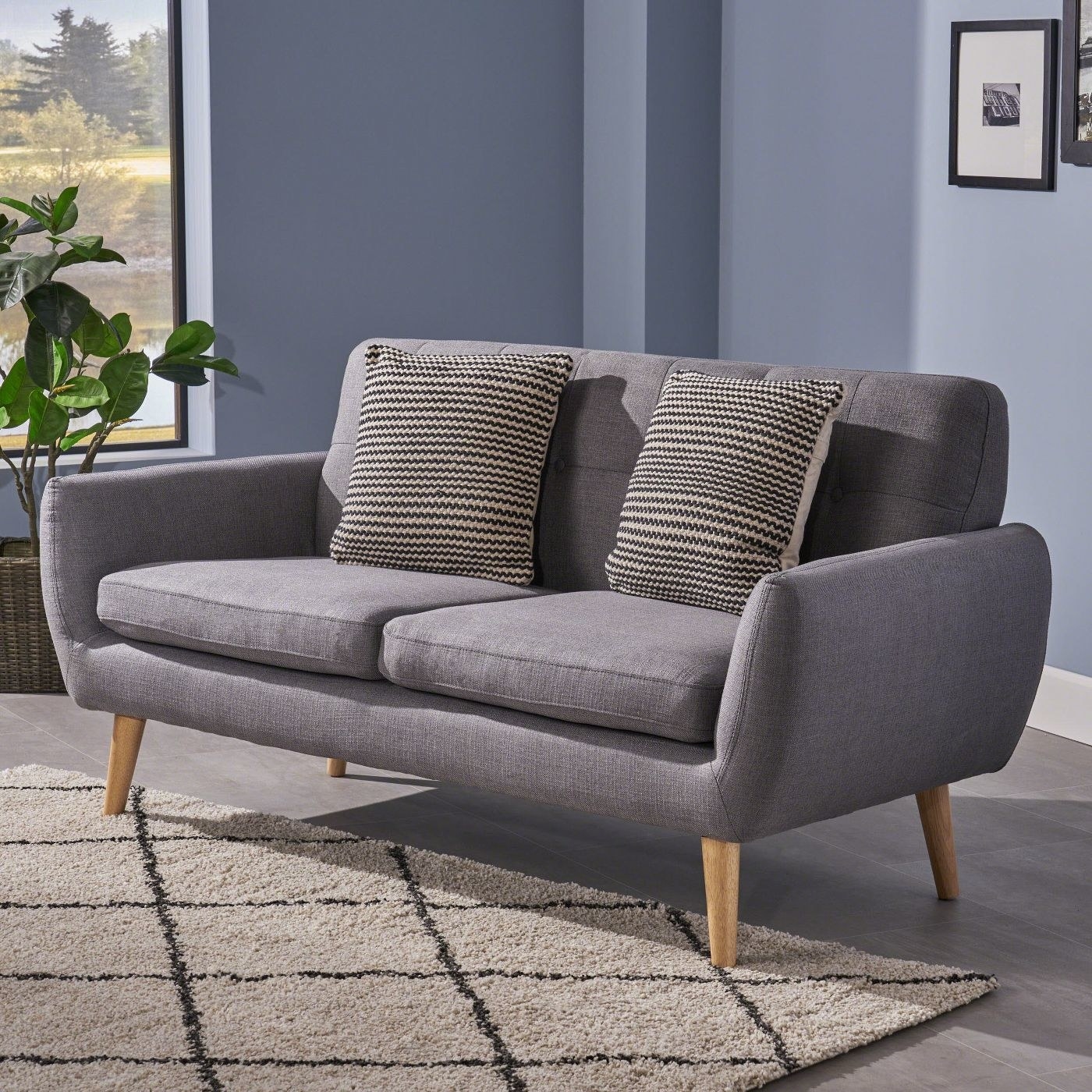 grey mid-century modern sofa with wooden legs
