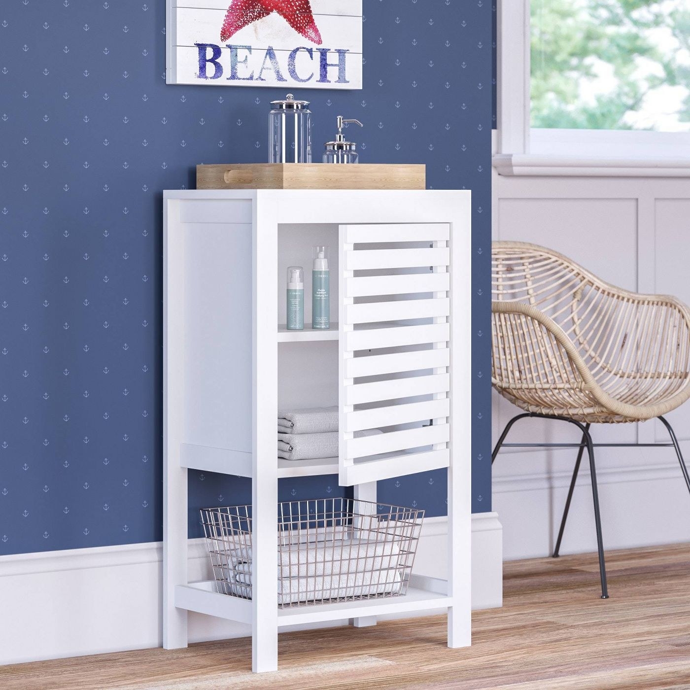 a white wooden linen cabinet
