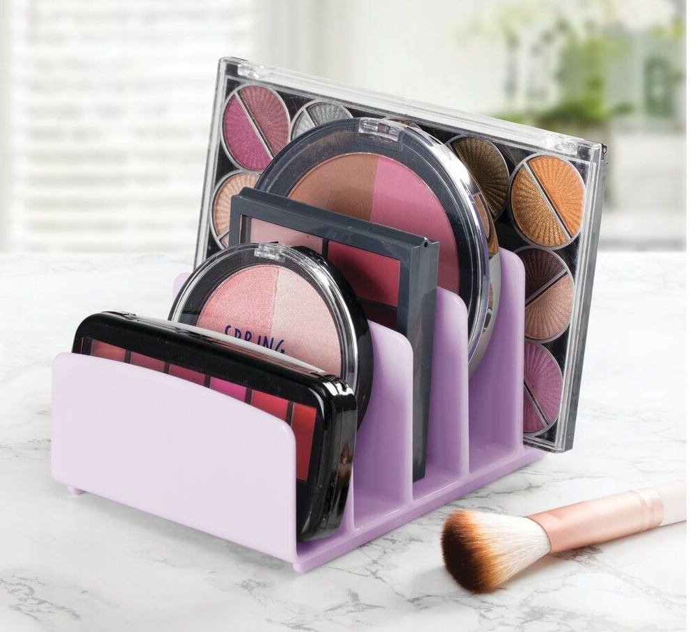 a lilac five slotted organizer with makeup palettes