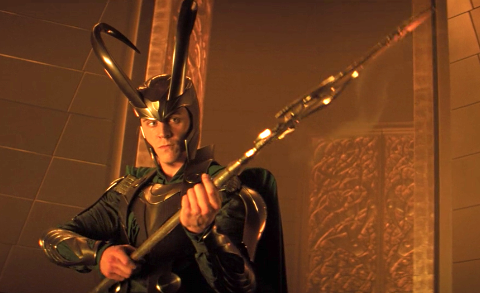 Loki wearing his massive helmet with huge curved horns bending up and back over his head