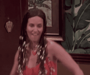 Monica Geller from Friends dancing with seashells in her hair
