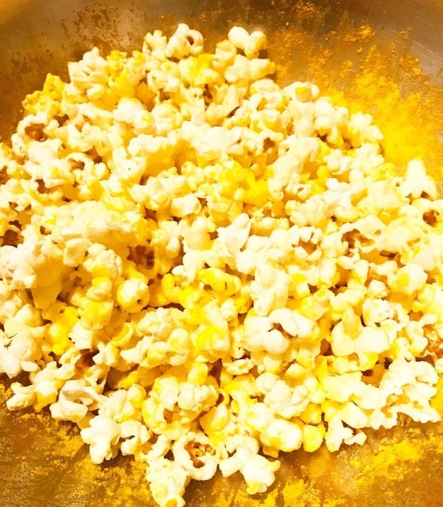 Popcorn seasoned with the cheese powder from mac &#x27;n&#x27; cheese.