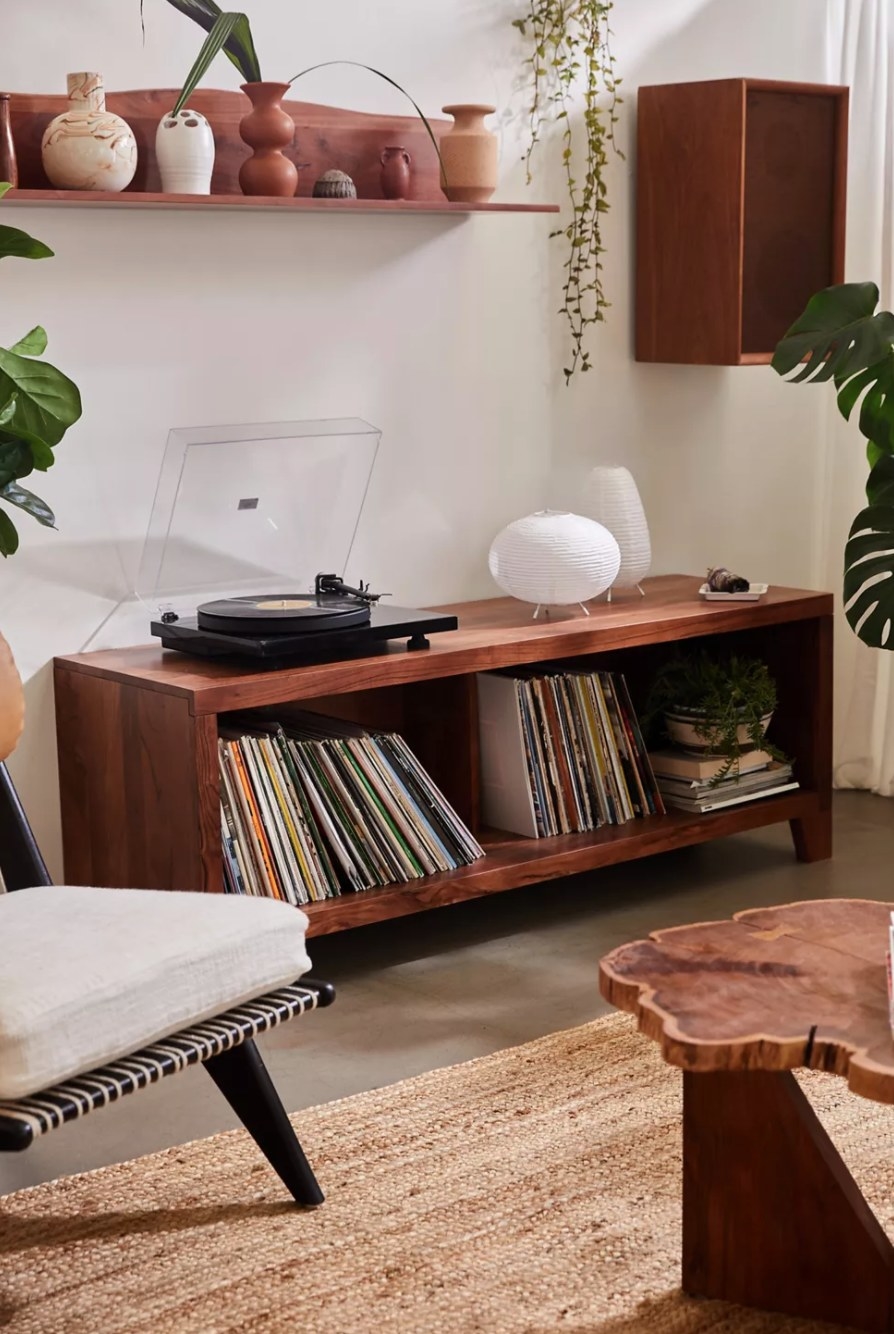 the cherry wood credenza holding records