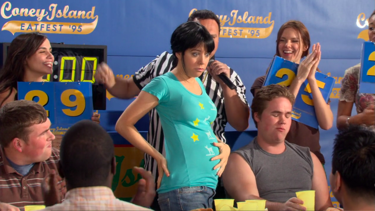 Lily holding her stomach after an eating contest in &quot;How I Met Your Mother&quot;
