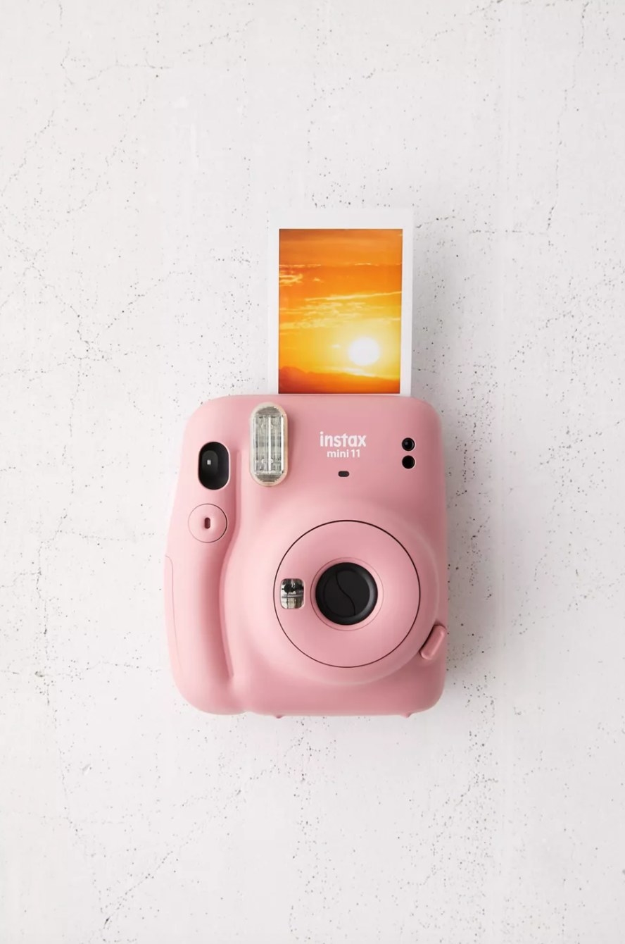 the small Fuijfilm camera in rose