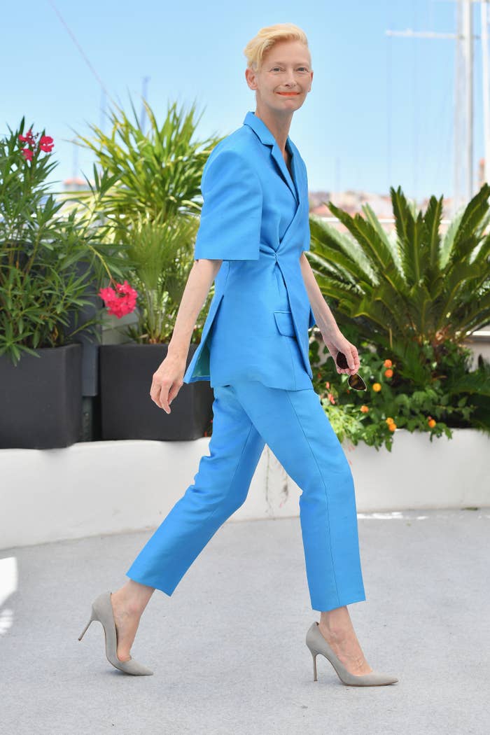 Tilda Swinton wears a pastel blue pantsuit at the Cannes Film Festival