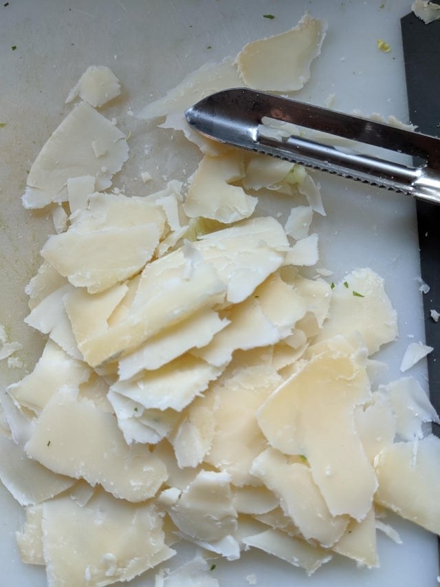 Parmesan grated with a vegetable peeler.