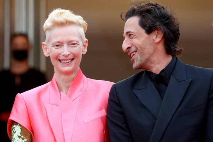 Tilda Swinton laughs with Adrien Brody at the Cannes Film Festival