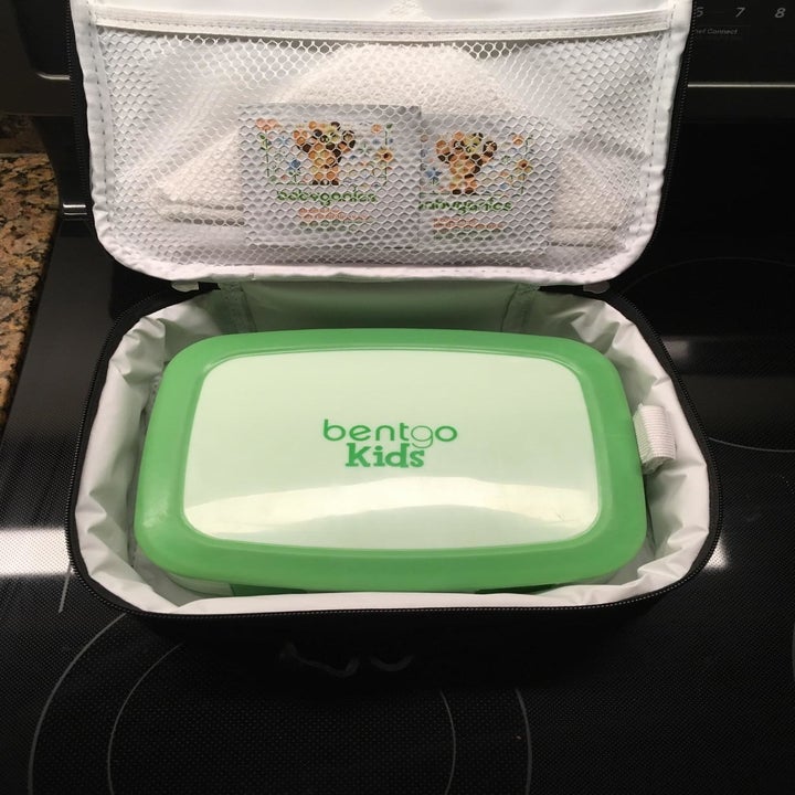 reviewer photo from above of the sealed green Bentgo container in a lunchbox