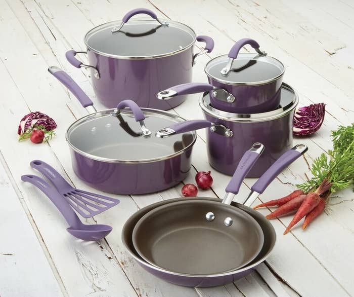 the purple cookware set on a counter