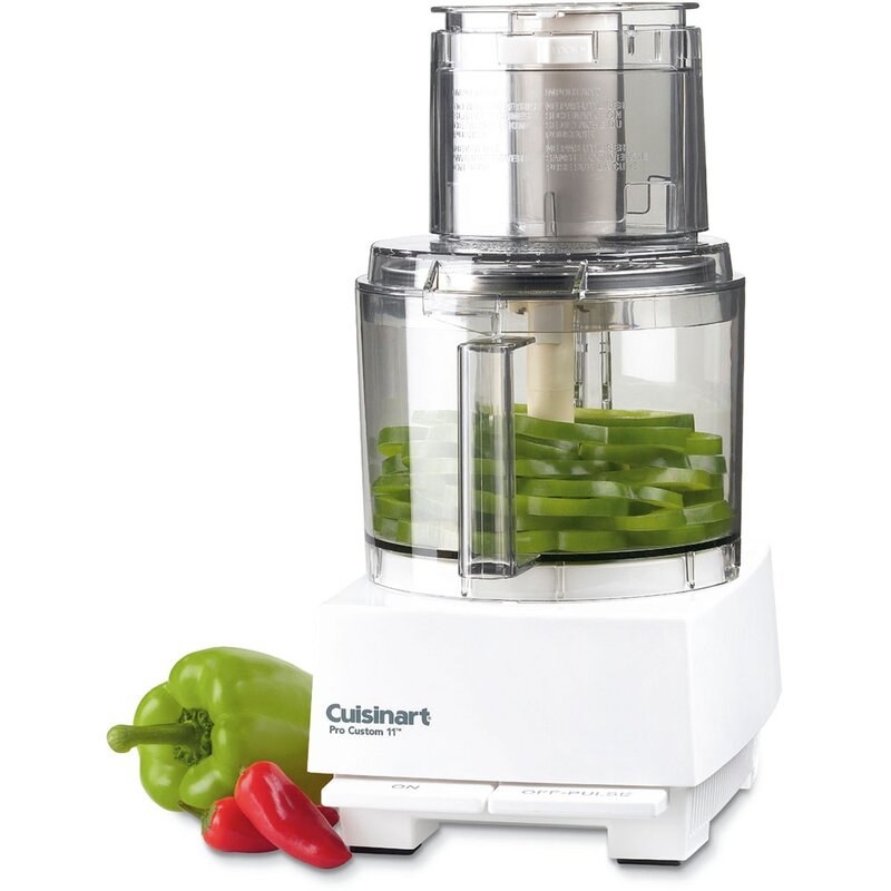 the white Cuisinart food processor next to a bell pepper