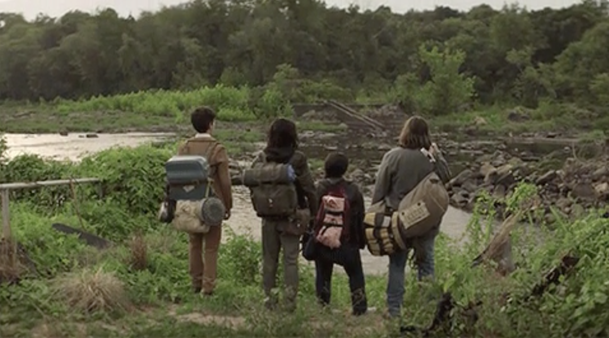 The cast staring out at the forest