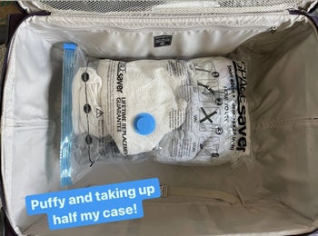 Jasmin's bulky clothes in a sealed bag with text: 