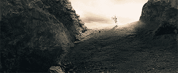 Gandalf riding on white horse.
