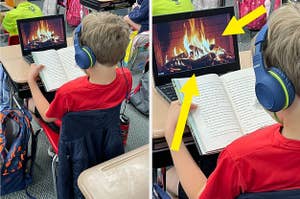A kid reading a book in front of a video of a fireplace