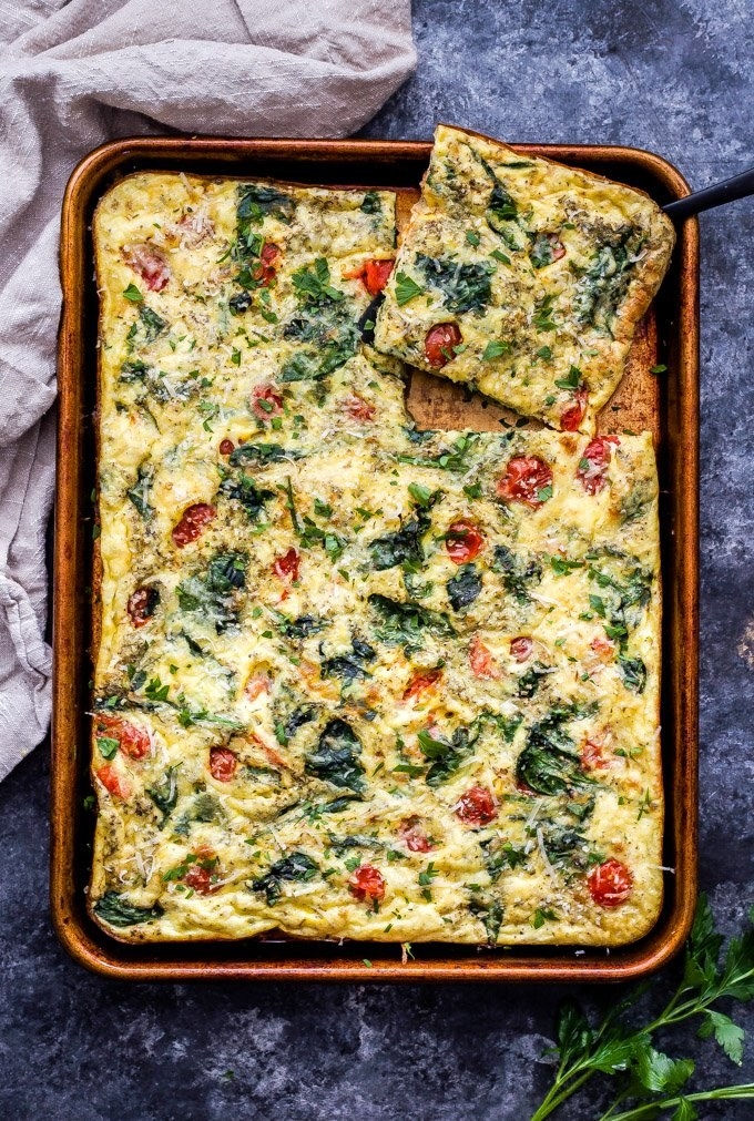 Sheet pan frittata with spinach and tomato.