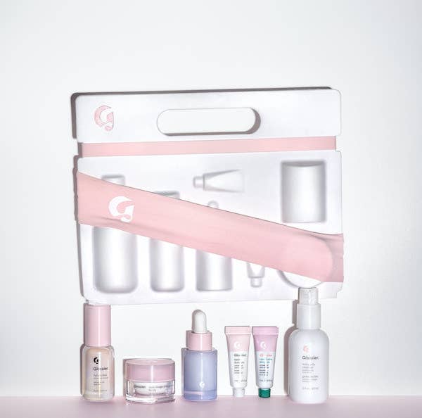 mini containers of Milky Jelly Cleanser, Super Bounce serum, and other Glossier skincare products