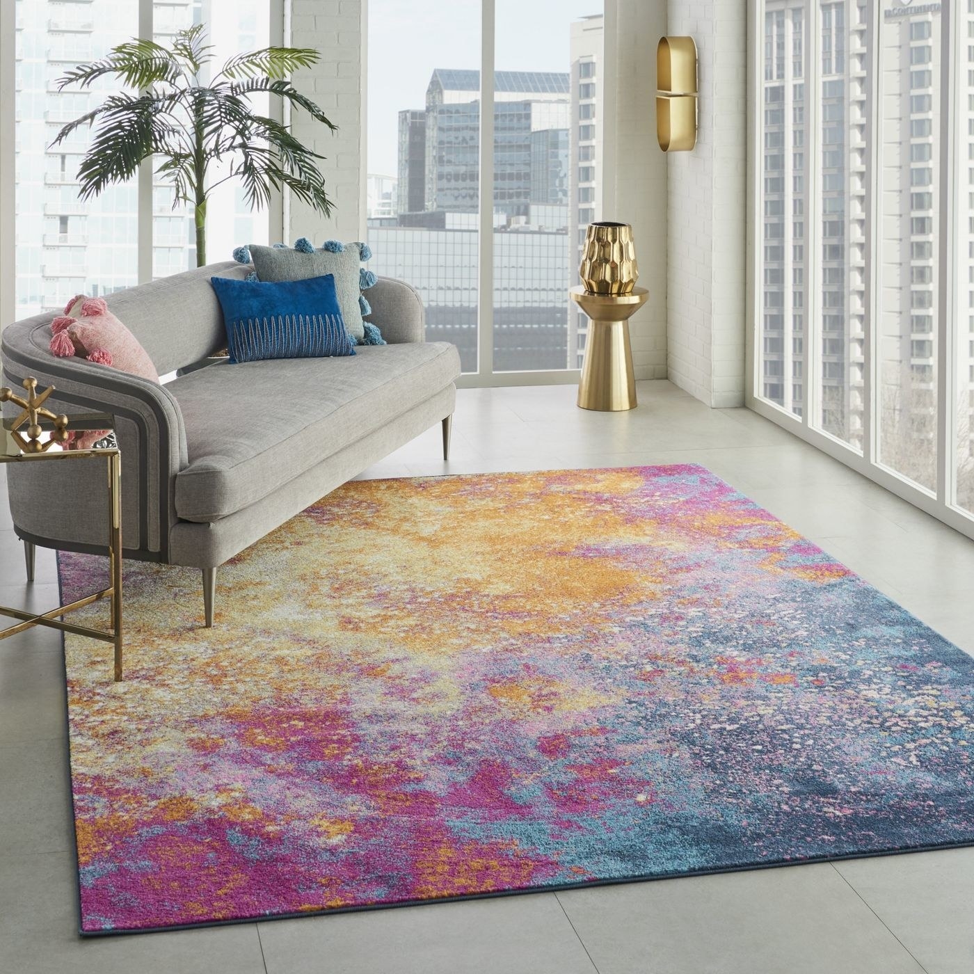 The yellow, pink, and blue rug